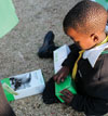 Alexandra children receive Schneider Electric solar lamps.